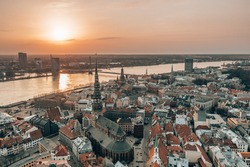 RIga Rooftop View Panorama At Sunset With Urban Architectures And Daugava River. View Of The Old Town