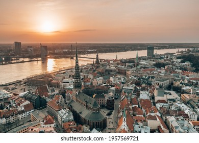 RIga rooftop view panorama at sunset with urban architectures and Daugava River. View of the old town - Powered by Shutterstock