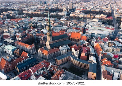 RIga rooftop view panorama at sunset with urban architectures and Daugava River. - Shutterstock ID 1957573021