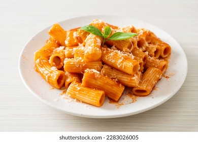 Rigatoni pasta with tomato sauce and cheese - traditional Italian pasta - Powered by Shutterstock