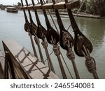 Rigging and ropes on an old sailing ship to sail in summer, the ship called Nao Victoria in Seville, Andalusia, Spain