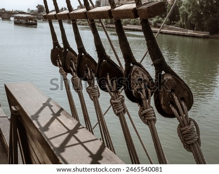 Rigging and ropes on an old sailing ship to sail in summer, the ship called Nao Victoria in Seville, Andalusia, Spain