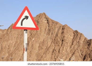 Right bend sign on Hatta mountain road in Dubai, UAE - Powered by Shutterstock
