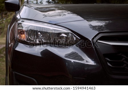 Right front of the lights of a subaru xv dark gray car four by four Stock photo © 