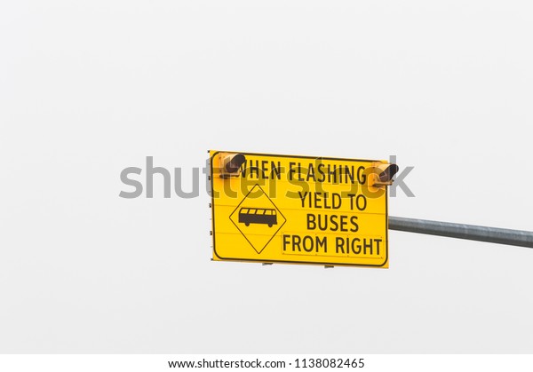 Right hand bus lane\
warning road sign.
