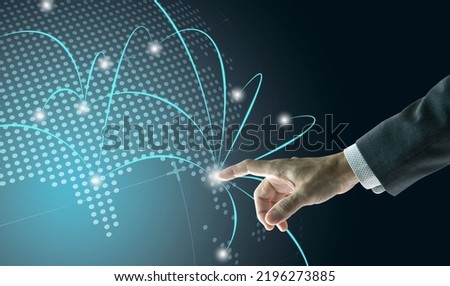 Right hand of a businessman touching digital globe to show business network growth to world wide