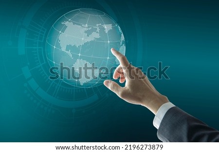 Right hand of a businessman touching futuristic digital globe to set business network growth to world wide