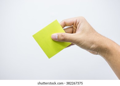 Right hand with a yellow paper
