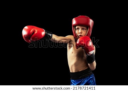 Similar – Image, Stock Photo little boy with boxing gloves on black background