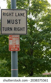 Right Lane Must Turn Right Street Sign With No Parking Sign Below