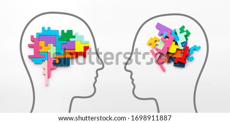 Right and left sides of the brain concept. Puzzle pieces in the shape of a brain