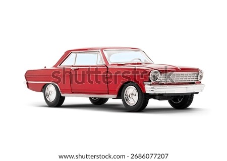  Right side front view of a red colored muscle model toy car photographed on a white background