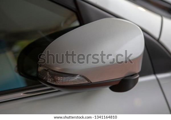 Right side\
mirror with turn right light of sedan\
car