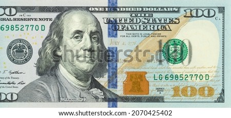 Right side of New 100 USA dollar bill. Photo image of American 100 dollars bill, 100 bucks, one hundred US dollars bank note. portrait of Benjamin franklin on the largest bank note in the U.S.A.  