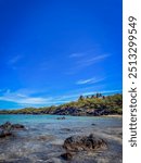 Right Side of Puako Bay with beautiful blue skies and water on the Big Island of Hawaii. 