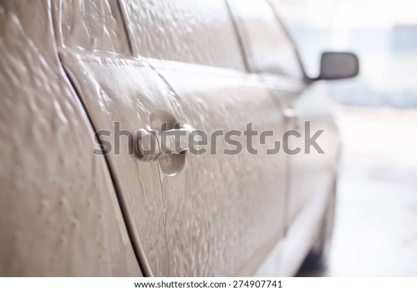 Right side of the\
silver car in shampoo