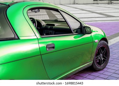 right side of small green sportcar