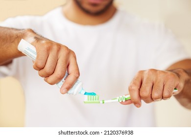 The right toothpaste makes all the difference. Cropped shot of a man putting toothpaste on his toothbrush. - Powered by Shutterstock