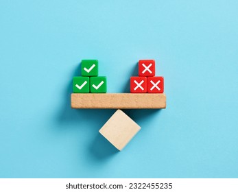 Right and wrong balance. Positive or negative decision making or choice of approval or rejection. Checkmark and cross symbols on balance on a scale seesaw.
