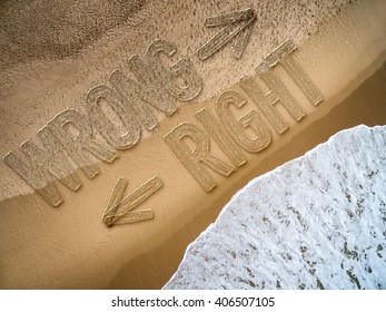 Right - Wrong written on the beach