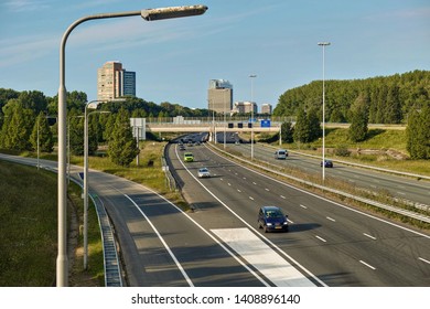 Rijswijk, ZH, Netherlands - May 25 2019: highway A4 with apartment building, bridge and European Patent Office building