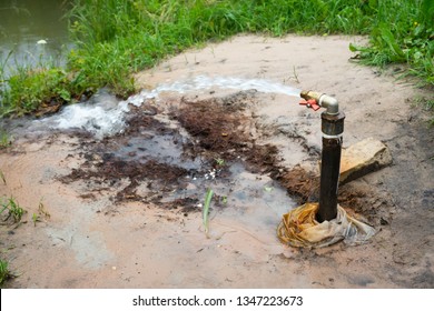 Rill, Borehole With Self-outflow. The Flow Of Groundwater. Pipe With A Crane. Water Flows By Itself. Water Extraction. A Jet Of Water Under Pressure. Pure Water. Little Brook. Groundwater Source.