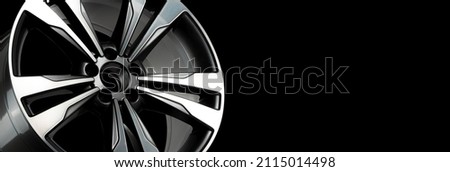 rim alloy wheel on a dark background. close-up wheel spokes of polished aluminum and gray elements.