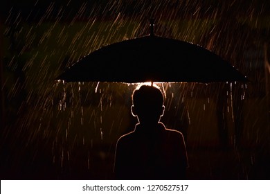 Rim Light Of A Boy Holding Umbrella