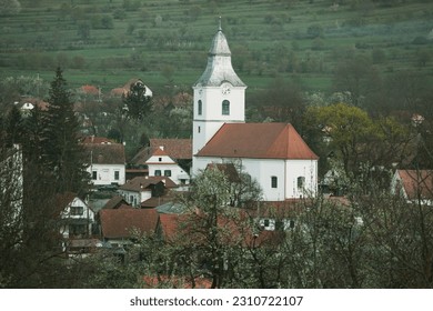 Rimetea is a small village located in Transylvania, Romania. It is situated in the Apuseni Mountains and is known for its picturesque setting and well preserved Hungarian architectural style. - Shutterstock ID 2310722107