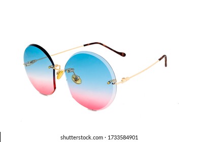 Rimless round sunglasses and blue to pink color gradient lenses   isolated white background  side view 