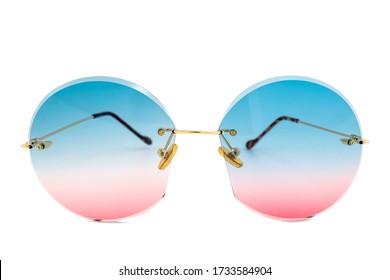 Rimless round sunglasses and blue to pink color gradient lenses   isolated white background  front view 