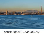 Rinconcillo beach in Algeciras, with a cloud of pollution floating over the industrial zone of Los Barrios.