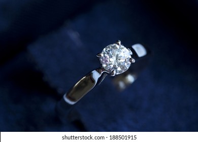 Ring with diamond into the gift box on the white background - Shutterstock ID 188501915