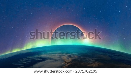Ring of fire - Solar Eclipse with aurora borealis "Elements of this image furnished by NASA "