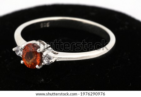 Ring of the jewelry with Rhodolite Garnet diamond on White background isolate
