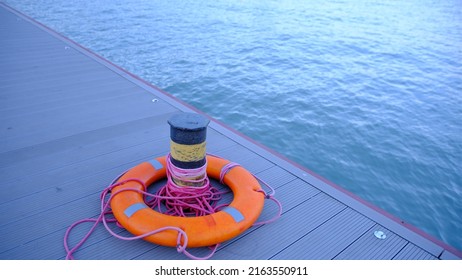 Ring Life Bouy On Pier Of Marina, Swimming Pool With Red Rope In Azov Sea, Mariupol