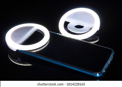 Ring Of Light And Cell Phone With Blue Lines