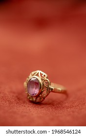 A Ring Placed On A Red Leather Close Up