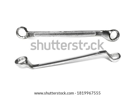 Ring spanner on white background.