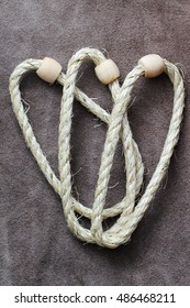 Ring Toss Game. Rope With Wooden Rings , Background Suede 2