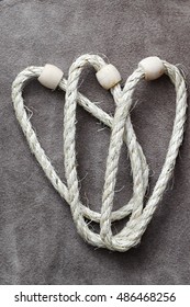 Ring Toss Game. Rope With Wooden Rings , Background Suede