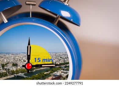 Ringing twin bell vintage classic alarm clock with the 15 minute city concept. - Shutterstock ID 2249277791