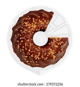 Ring-like Chocolate Cake With Nut Crumbs. One Piece Was Cut Off. This Made The Image Similar To A Business Or Financial Diagram, Pie Chart Or Infographics In A Concept Of 'part And Whole'. 