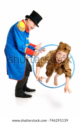 Ringmaster Circus Director, isolated on white background, senior man making his little wild animal jump through a hoop