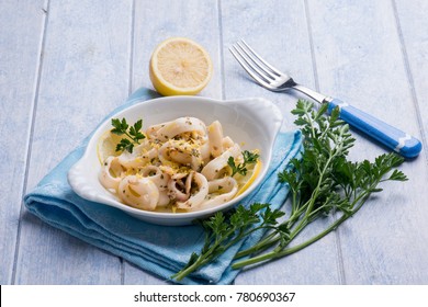 rings squid with parsley and grated lemon peel