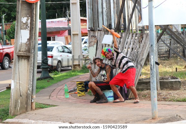 RIO BRANCO, ACRE, BRAZIL - DECEMBER 03, 2019:\
when two street performers take a break and wait for the red light\
to close, to introduce themselves to their audience, in this case\
the car drivers.\
