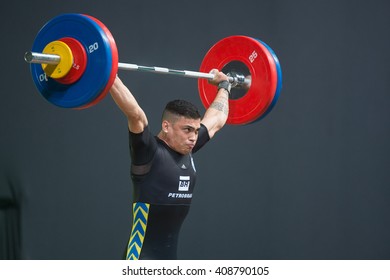 Rio, Brazil - April 4, 2016: ANDRADE DE SOUSA Matheus Delan (BRA) in the male category during the Aquece Rio Weightlifting Test Event at the Arena Carioca 1