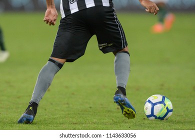Rio, Brazil - july 26, 2018: soccer cleat and soccer ball on the lawn in match between Botafogo and Chapecoense by the Brazilian Championship in Nilton Santos Stadium