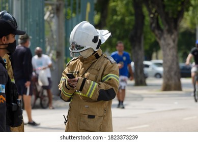 Rio, Brazil - September 28, 2020:fireman Man Makes Notes On His Cell Phone