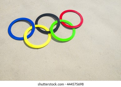 RIO DE JANEIRO - APRIL 4, 2016: Olympic rings rest in the sand on Ipanema Beach in anticipation of the city hosting the 2016 Summer Games.